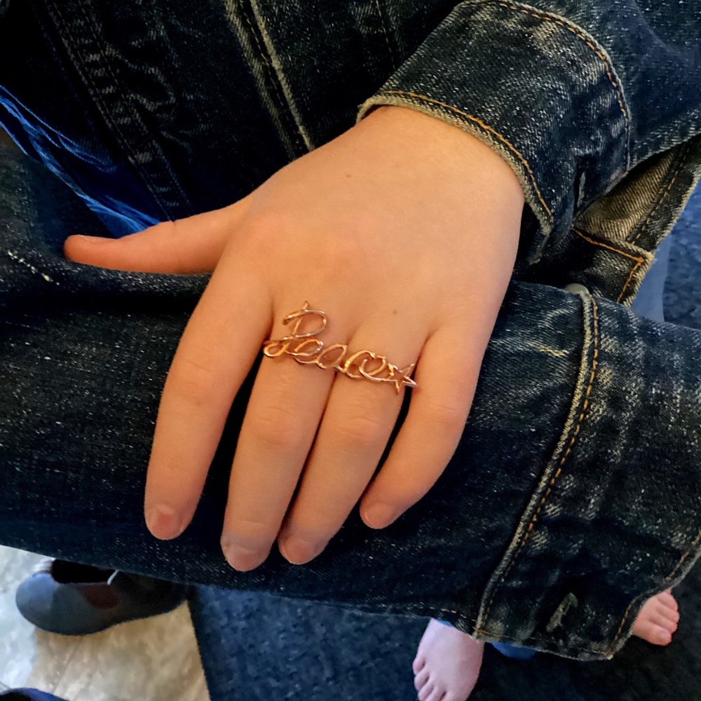 Peace sterling silver ring and rose gold. NWT  REM